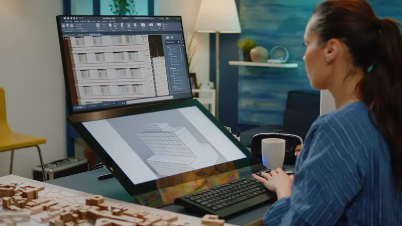 architect working on 2 screens